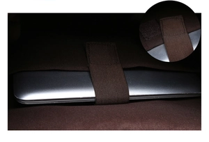 Detail of internal laptop compartment with elastic strap and velcro fastener in backpack