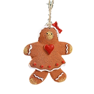 Resin gingerbread man ornament with red heart and bow on white background
