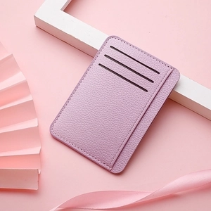 Detailed shot of lavender pebble grain PU leather card holder with three vertical slots