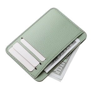 Detail of mint green PU leather card holder showing lychee grain texture and card slots