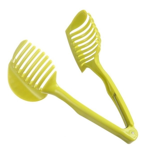 Manual lemon slicer holder in lime green plastic for uniform tomato and fruit slices
