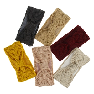 Detail showing plush fleece lining and knitted texture on variety of winter headbands