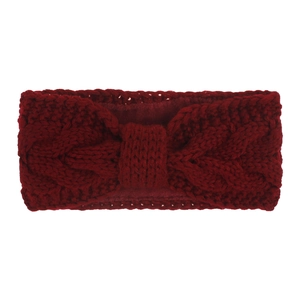 Macro view of burgundy cable knit headband with warm lining and bow design