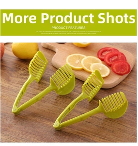 Close-up of green tomato and lemon slicer guide tool on a wooden kitchen table