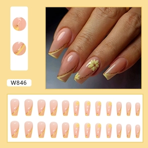 Long trapezoidal press-on nails featuring lemon yellow French tips and 3D floral accents
