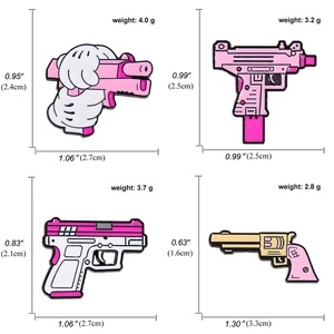 Pink cartoon pistol enamel pins set with detailed dimensions and weight on white background