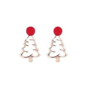 Detail view of gold Christmas tree stud earrings with festive red dot accents