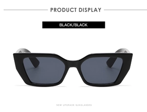 Detailansicht der schwarzen Cat-Eye-Sonnenbrille mit breiten Bügeln und dunklen Gläsern