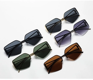 Detail view of stylish half-frame sunglasses in multiple colors and metallic frames