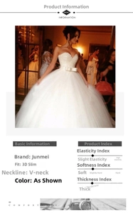 Détail de la robe de mariée blanche à paillettes avec col en V et nœud à la taille