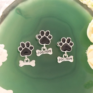 Pet paw and bone charms with Dog Mom engraving in black and silver alloy finish