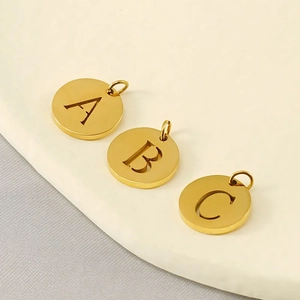Three gold-plated stainless steel hollow alphabet pendants in A, B, and C styles