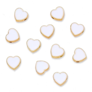 Detailed view of eleven 8mm gold-plated heart-shaped beads with white enamel for DIY jewelry