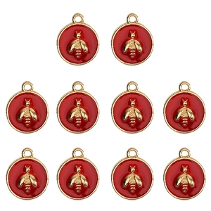 Golden bee pendants with red enamel finish for DIY jewelry making and craft projects