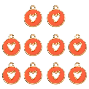 Detail view of ten orange and gold hollow heart charms for DIY jewelry making