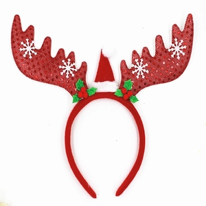 Christmas reindeer antler headband with sequins and a mini Santa hat on white background