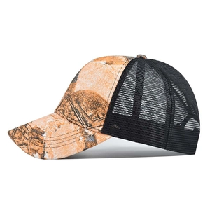 Detail of breathable black mesh and camouflage printed fabric on the trucker hat