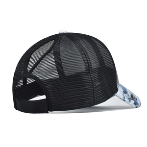 Detail of breathable mesh back and ponytail cross opening on a black tie-dye cap