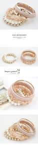 Detailed close-up of multi-layer bracelet set with faux pearls, lace, and satin ribbon