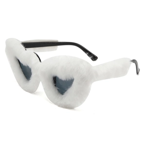 Detail of white fuzzy heart sunglasses with plush frame and sleek black temple arms