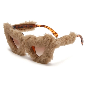 Detail of heart sunglasses with brown faux fur trim and tortoiseshell patterned temples