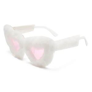 Macro shot of fluffy white heart-shaped sunglasses with pink lenses for party style
