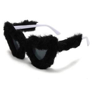 Detail of heart sunglasses with black faux fur trim and contrasting white temples