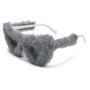 Macro shot of gray faux fur textured heart sunglasses with minimalist white temple arms