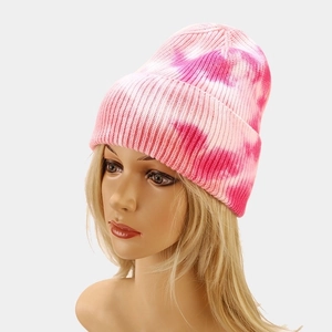 Women's tie-dye knit beanie in pink core-spun yarn with cuffed hem for outdoor warmth