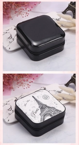Detail view of mini portable jewelry boxes with Paris tower print and zipper closure