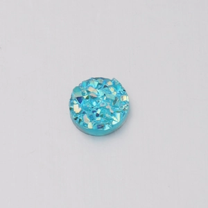 Close-up of sky blue 6mm round resin druzy stone with textured crystal surface