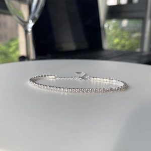 Detailed macro view of S925 sterling silver tennis bracelet with cubic zirconia row