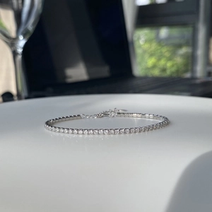 S925 sterling silver tennis bracelet with cubic zirconia on a white display surface