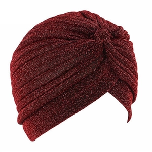 Close-up of wine red turban cap with metallic shiny thread and pleated texture details