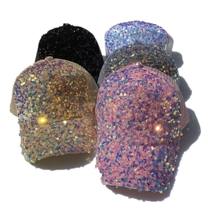 Close-up of sparkling sequin baseball caps in various colors with breathable mesh back