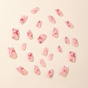 Square Halloween false nails with white French tips and red blood splatter patterns