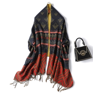 Close-up of diamond lattice scarf with ethnic geometric patterns and tassel fringe details