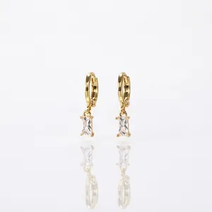 Elegant gold hoop earrings featuring rectangular cubic zirconia drops on white background