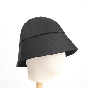 Minimalist black canvas bucket hat with structured brim and stitching for women
