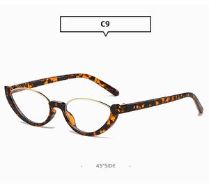 Vista dettagliata di occhiali da sole cat-eye con montatura semi-aperta dorata e tartaruga