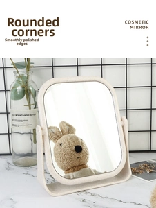 Detail of desktop cosmetic mirror featuring smooth rounded edges and U-shaped rotating stand