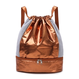 Metallic bronze drawstring sports bag with white mesh sides and bottom shoe compartment