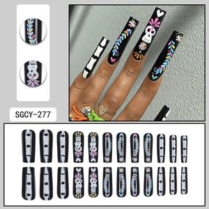 Long square Halloween press-on nails with colorful skull designs on black base