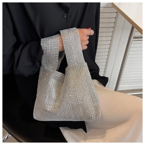 Detailed view of silver rhinestone hobo bag showing sparkling crystal mesh surface