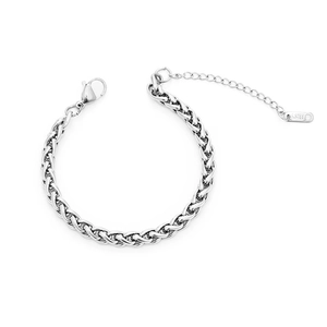 Detailed macro view of wheat chain bracelet with lobster clasp and S.STEEL material tag