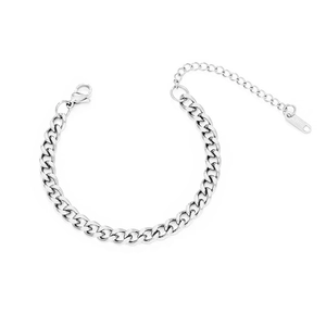 Macro shot of silver stainless steel Cuban chain bracelet with lobster clasp and extender