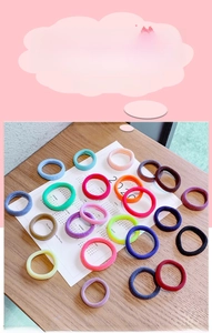 Close-up of high-elasticity seamless towel hair ties in various bright candy colors