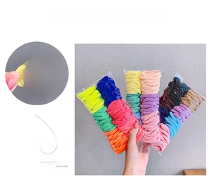 Macro shot of colorful high-elasticity hair ties showing stretch detail and variety pack