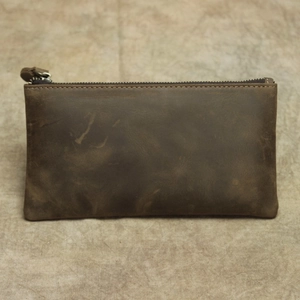 Detailed view of the brown crazy horse leather wallet with premium metal zipper closure