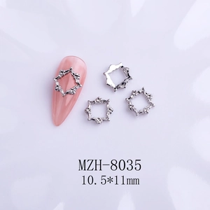 Detailed view of silver bow-knot alloy nail charms with dimensions 10.5x11mm